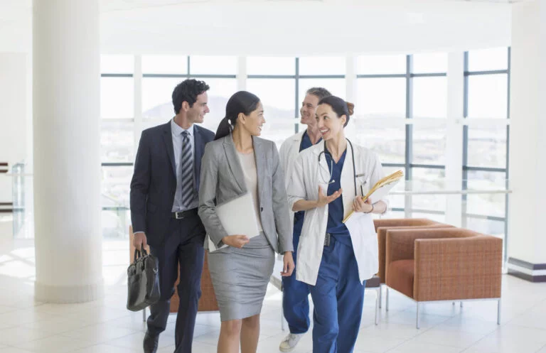 Doctors and business people talking