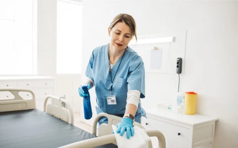 Nurse cleaning hospital ward.
