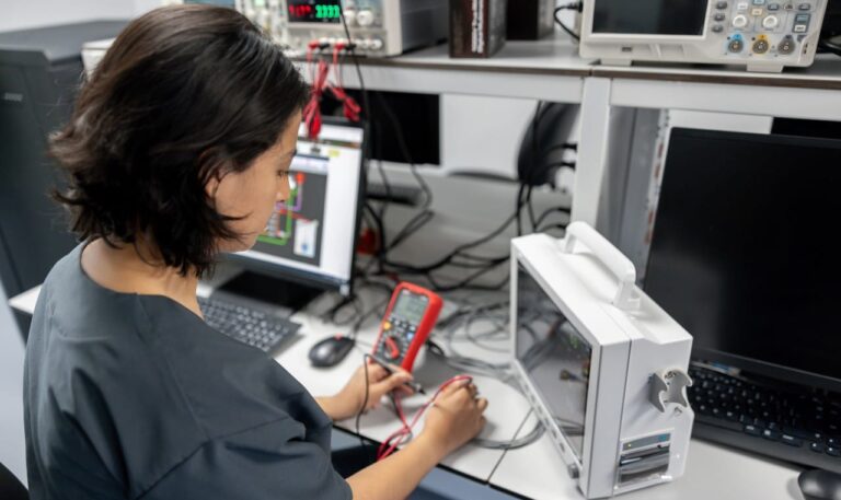 Maintenance engineer repairing medical equipment